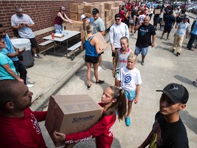 Volunteers unload a truck of relief supplies for people impacted by Hurricane Harvey on September 3, 2017, in Houston. (Brett Coomer/Getty Images)