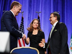 U.S. Trade Representative Robert Lighthizer, left, shakes hands with Canadian Foreign Affairs Minister Chrystia Freeland, accompanied by Mexico's Secretary of Economy Ildefonso Guajardo Villarreal, after they spoke at a news conference, Wednesday, Aug. 16, 2017, at the start of NAFTA renegotiations in Washington. A round of NAFTA negotiations is about to start in a country that's served as Donald Trump's political whipping boy. Increasingly, there are indications Mexico is willing to whip back. THE CANADIAN PRESS/ AP/Jacquelyn Martin