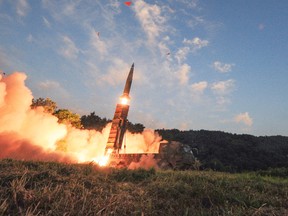 In this photo provided by South Korea Defense Ministry, South Korea's Hyunmoo II ballistic missile is fired during an exercise at an undisclosed location in South Korea, Monday, Sept. 4, 2017. In South Korea, the nation's military said it conducted a live-fire exercise simulating an attack on North Korea's nuclear test site to "strongly warn" Pyongyang over the latest nuclear test. Seoul's Joint Chiefs of Staff said the drill involved F-15 fighter jets and the country's land-based "Hyunmoo" ballistic missiles. The released live weapons "accurately struck" a target in the sea off the country's eastern coast, the JCS said. (South Korea Defense Ministry via AP)