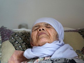106-year old Afghan refugee Bibihal Uzbeki lies in bed in Hova, Sweden, Sunday, Sept. 3, 2017, and despite being severely disabled and barely able to speak, she is facing deportation from Sweden after her asylum application was rejected. Bibihal Uzbeki made a perilous journey to Europe, carried by her son and grandson through mountains, deserts and forests, but has suffered a debilitating stroke and now faces deportation. (AP Photo/David Keyton)