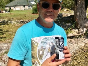 Doug Gilmour holds a KLR93 beer from Whitewater Brewing on Saturday, Sept. 2, 2017. (Joe Warmington/Toronto Sun)