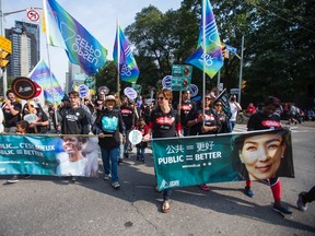 Participants march in Monday's Labour Day Parade in Toronto. (ERNEST DOROSZUK, Toronto Sun)