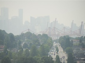 An air quality warning continues as particulate-filled haze obscures downtown buildings from Burnaby Heights, Vancouver, August 2, 2017. (Gerry Kahrmann/Postmedia Network)