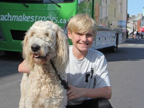 Zach Hofer, 13, and his dog Lokie brought their Zach Makes Tracks campaign to Kingston city hall on Saturday. The Barrie teen is raising money for and awareness of children's mental health. (Steph Crosier, The Whig-Standard)