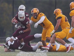 Ottawa Gee-Gees’ Bryce Vieira rushes against the Queen’s Gaels during yesterday’s game. (Tony Caldwell/OTTAWA SUN)