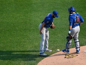 Jake Arrieta of the Chicago Cubs grabs his leg after an apparent injury in the third inning against the Pittsburgh Pirates at PNC Park on Sept. 4, 2017. (Justin Berl/Getty Images)