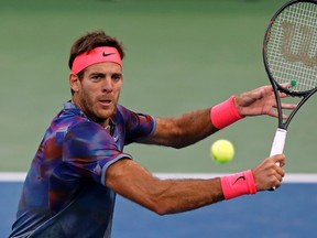 Juan Martin del Potro hits a return shot to Dominic Thiem during the fourth round of the U.S. Open on Sept. 4, 2017. (AP Photo/Adam Hunger)