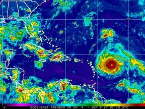 This Monday, Sept. 4, 2017, satellite image provided by the National Oceanic and Atmospheric Administration shows Hurricane Irma nearing the eastern Caribbean. Hurricane Irma grew into a powerful Category 4 storm Monday. (NOAA via AP)