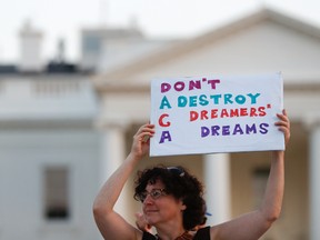 Julia Paley, of Arlington, Va., with the DMV Sanctuary Congregation Network, holds up a sign that reads "DACA Don't Destroy Dreamers Dreams" during a rally supporting Deferred Action for Childhood Arrivals, or DACA, outside the White House, in Washington, Monday, Sept. 4, 2017. A plan President Donald Trump is expected to announce Tuesday for young immigrants brought to the country illegally as children was embraced by some top Republicans on Monday and denounced by others as the beginning of a "civil war" within the party. (AP Photo/Carolyn Kaster)