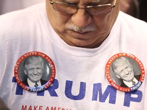 Republican presidential candidate Donald Trump campaign pins are seen on a supporters shirt during a campaign rally at Verizon Wireless Arena on February 8, 2016 in Manchester, New Hampshire. (Joe Raedle/Getty Images)