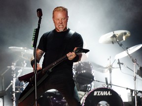 In this July 29, 2017, file photo, James Hetfield of Metallica performs during the band's concert at The Rose Bowl in Pasadena, Calif. Hetfield fell on stage during a show in Amsterdam on Monday, Sept. 5, 2017. The singer told the crowd he was OK. (Photo by Chris Pizzello/Invision/AP, File)