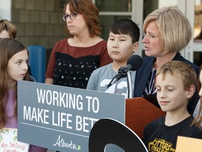 Premier Rachel Notley speaks surrounded by Grade 6 students at the opening of École Lois E. Hole Elementary School in St. Albert, Alberta on Tuesday, September 5, 2017. Ian Kucerak / Postmedia