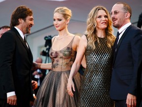 From left, actors Javier Bardem, Jennifer Lawrence, Michelle Pfeiffer and director Darren Aronofski pose for photographers at the premiere of the film 'mother!' at the 74th edition of the Venice Film Festival in Venice, Italy, Tuesday, Sept. 5, 2017. (AP Photo/Domenico Stinellis
