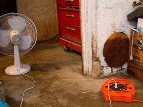 Fans, dehumidifiers and wet vacs are in heavy use in basements along Queens Avenue in London, Ont. on Tuesday June 23, 2015. (Free Press file photo)