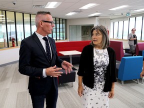 St. Lawrence College president and CEO Glen Vollebregt and Kingston and the Islands MPP Sophie Kiwala tour the new innovation hub at the Kingston campus of St. Lawrence College on Tuesday. (Ian MacAlpine/The Whig-Standard)