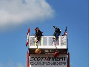 Competitors must haul a 42-lbs hose roll up three storeys, hand over hand as part of the Scott FireFit Challenge