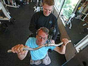 Trainer Ryan Armitage with John Woodhouse, who has dystonia and is a double leg amputee.