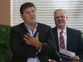 Dr. Tim Hildebrand, a medical officer of health, speaks during a press conference outlining a new type of influenza vaccine, at the Concordia Place personal care home in East Kildonan, on Tues., Sept. 5, 2017. Health Minister Kelvin Goertzen is behind him. Kevin King/Winnipeg Sun/Postmedia Network