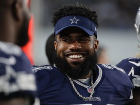 This Aug. 12, 2017 file photo shows Dallas Cowboys running back Ezekiel Elliott looking on from the sidelines during the second half of a preseason NFL football game against the Los Angeles Rams in Los Angeles. (AP Photo/Jae C. Hong, file)