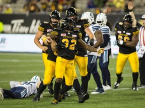 Tiger-Cats running back C.J. Gable celebrates the go-ahead touchdown against the Argos during the Labour Day classic. (The Canadian Press)
