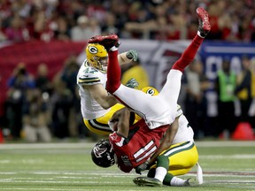 Julio Jones #11 of the Atlanta Falcons makes a catch in the third quarter against Jake Ryan #47 and LaDarius Gunter #36 of the Green Bay Packers in the NFC Championship Game at the Georgia Dome on January 22, 2017 in Atlanta, Georgia. (Streeter Lecka/Getty Images)