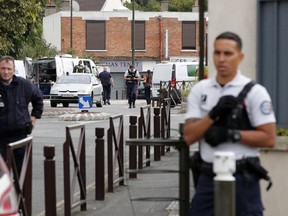 French police officers secure the area as two people have been detained after a possible explosives laboratory was discovered in Villejuif, south of Paris, Wednesday, Sept. 6, 2017. (AP Photo/Christophe Ena)