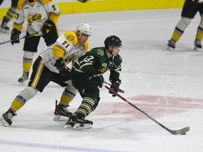 London Knights forward Jesper Bratt tries to use his speed to evade Adam Ruzicka of the Sarnia Sting during an OHL preseason game at Budweiser Gardens in London on Friday. (DEREK RUTTAN, The London Free Press)