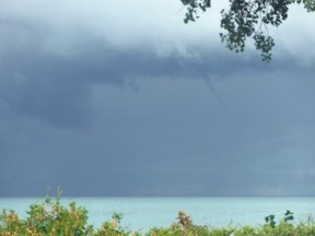 A funnel cloud became a water spout off Kincardine's shoreline on Sept. 6, 2017 at about noon, lasting for about two minutes. Pictured: Joan Mowle snapped photos of the clouds from her lakefront home. (Shared photo by Joan Mowle)
