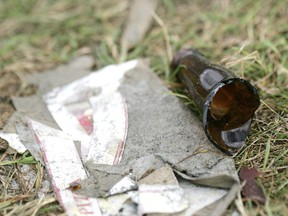 Broken beer bottles litter the yards and sidewalks of Thurman Circle in this Free Press file photo.