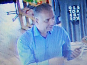 Kingston Police have released a photo of a suspect wanted in connection with two frauds committed in June and August of 2017. Submitted Photo /The Whig-Standard/Postmedia Network