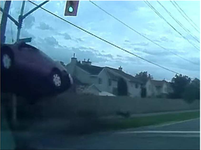 Capture from YouTube video of single vehicle crash into traffic light, Carleton Place, Ontario