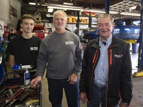 Tyson Witlox, 14, is starting in the family business, working this summer at Witlox Automotive. The eight-bay garage was established by his grandfather John Witlox, far right, in 1967, and is now owned by his father, Mark Witlox. (MIKE HENSEN, The London Free Press)
