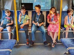 Adrian Crook's children ride a bus in Vancouver in a handout photo. The case of a British Columbia father who says the Children's Ministry barred him from letting his children ride the bus alone is sparking debate about when parents should be allowed to leave their kids unsupervised. THE CANADIAN PRESS/HO-Adrian Crook