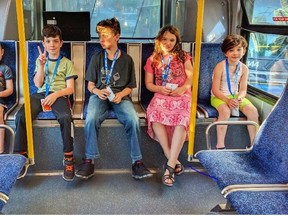 Adrian Crook's children ride a bus in Vancouver in a handout photo.(THE CANADIAN PRESS/HO-Adrian Crook)