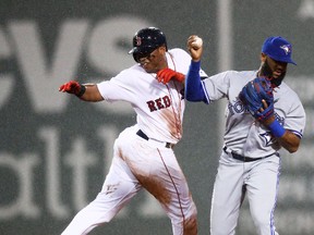 Rafael Devers of the Boston Red Sox collides with Richard Urena of the Toronto Blue Jays at second base during the fourth inning at Fenway Park on Sept. 6, 2017. (Maddie Meyer/Getty Images)