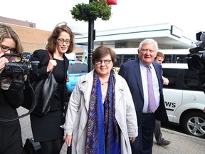Pat Sorbara, the former deputy chief of staff under Liberal Premier Kathleen Wynne  and her lawyer Brian Greenspan make their way into court on Cedar Street in Sudbury, Ont. on Thursday September 7, 2017. The Gerry Lougheed Jr. and Pat Sorbara bribery trial under the Ontario Election Act got underway on Thursday morning.Gino Donato/Sudbury Star/Postmedia Network