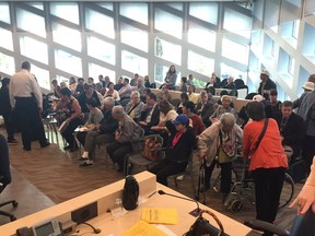 Supporters of Chinatown pack a committee room Thursday, saying they are 'insulted' at the terms for an advisory committee on safe injection sites. ELISE STOLTE / POSTMEDIA