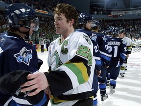 Former Team Canada teammates Danny Syvret #25 of the London Knights and Sidney Crosby #87 of the Rimouski Oceanic shake hands after the Knights defeated Oceanic 4-0 in the Memorial Cup Tournament championship game at the John Labatt Centre on May 29, 2005 in London, Ontario, Canada. (Dave Sandford/Getty Images)