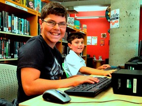 Noah Van Bonn, left and Nathan Moule were using computers at the downtown St. Thomas Public Library earlier this week. More than 630 students took part in the library’s TD Summer Reading Club this summer, a jump from last year’s program. (Louis Pin/The Times-Journal)