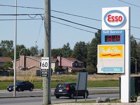 A sign at a service station on Woodroffe Avenue shows a price of 131.9 per litre on Saturday.