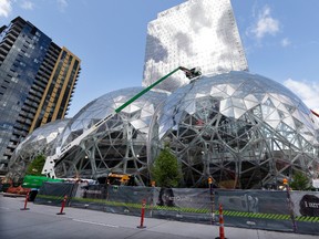 Construction continued in April on three large, glass-covered domes as part of an expansion of the Amazon.com campus in downtown Seattle. (AP PHOTO)