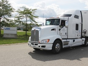 Gary Johnston, a driver with JDW International Trucking, pulls through the exit at 21 Ube Dr. in Sarnia. The company has been based at the former wheel plant since 2015. (Tyler Kula/Sarnia Observer)