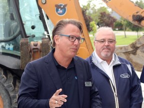 Perth East Coun. Jerry Smith, right, looks on as Union Gas district manager Steven Jelich speaks during a press conference on the installation of a new pipeline on Thursday, Sept. 7, 2017 in Milverton, Ont. (Terry Bridge/Stratford Beacon Herald)