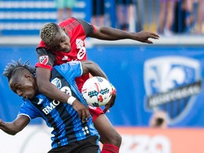 Toronto FC’s Chris Mavinga challenges Montreal Impact’s Dominic Oduro during a game this season. (THE CANADIAN PRESS)