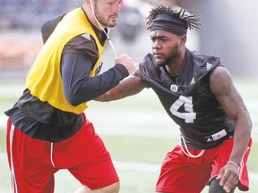 Redblacks defensive back Jerrell Gavins (right), getting ready for tomorrow’s home tilt against the Ticats, just returned from Miami where his girlfriend gave birth. He’ll likely head back after the game with Hurricane Irma hurtling toward Florida. (Tony Caldwell, Postmedia Network)