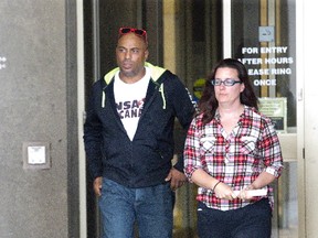 Markus Desousa, accompanied by his wife, Stephanie, leaves the London courthouse Thursday. Desousa delivered a victim impact statement in court, describing his injuries and the consequences of losing his close friend. (DEREK RUTTAN, The London Free Press)