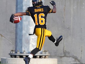 Hamilton Tiger-Cats' Brandon Banks high steps for the first touchdown. vs. the Ottawa Redblacks in Hamilton Ont. on July 26, 2014. (Craig Robertson/Toronto Sun)