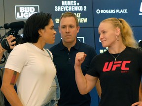 Mixed martial arts fighters Amanda Nunes (left) and Valentian Shevchenko (right) pose for photos at Rogers Place in Edmonton on Wednesday September 6, 2017.