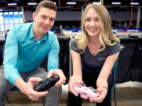 Jake MacDonald, a Western Fair District photographer/graphic designer (left), and Robyn Baker, the organization’s senior events co-ordinator, are ready to press start inside the Progress Building where free play video game sessions and mini tournaments will take place throughout this year’s 10-day Western Fair. (CHRIS MONTANINI, Londoner)