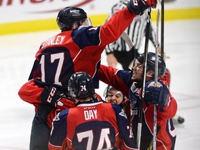 Windsor Spitfires defenceman Logan Stanley (17) celebrates his goal against the Windsor Spitfires during second period Memorial Cup final hockey action in Windsor, Ont., on Sunday, May 28, 2017. Stanley was the Jets "other" first round pickin 2016. Adrian Wyld/THE CANADIAN PRESS Files